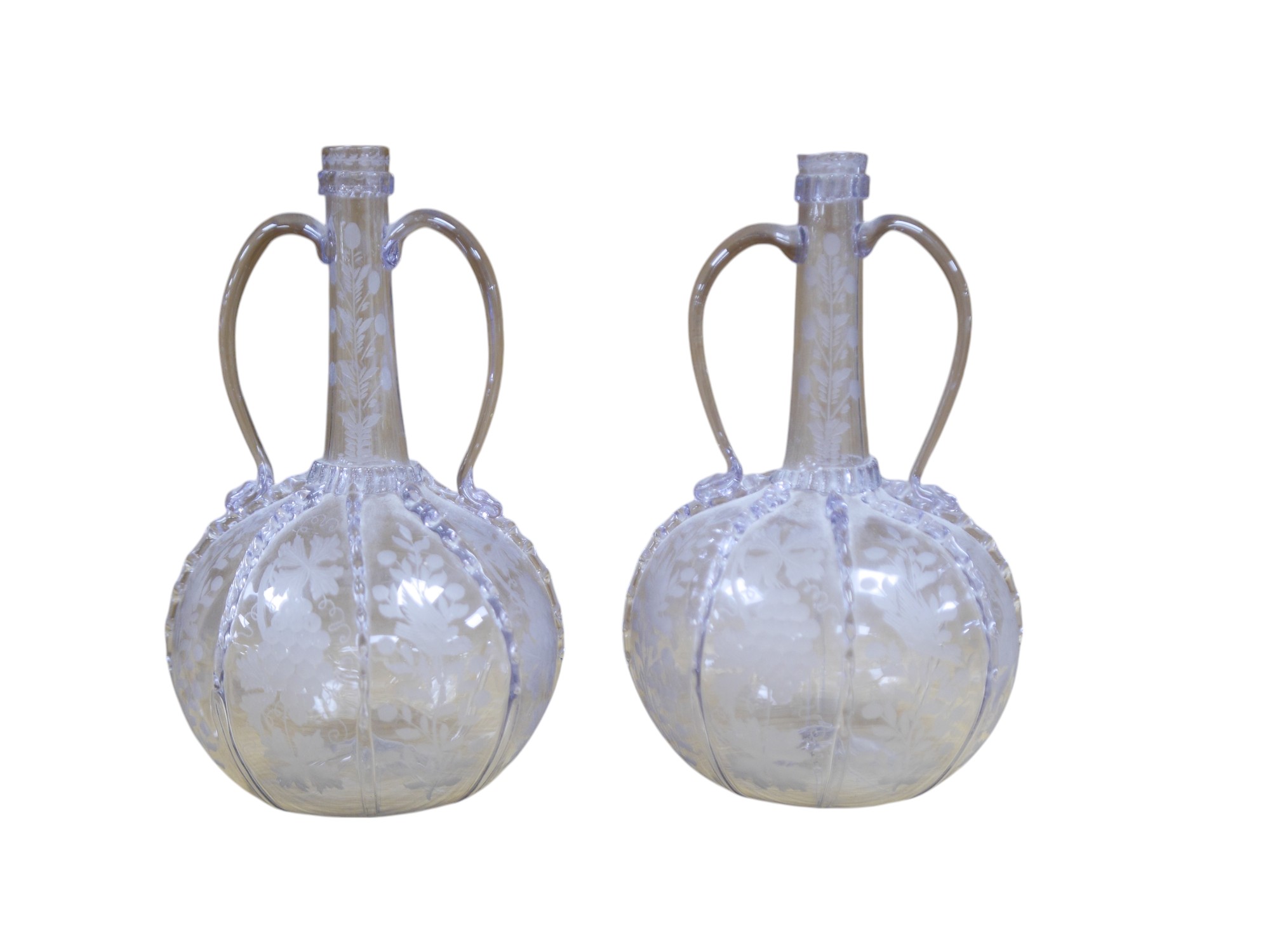 A pair of 18th century wheel engraved Dutch two handled glass decanters, 23cm high. Condition - good